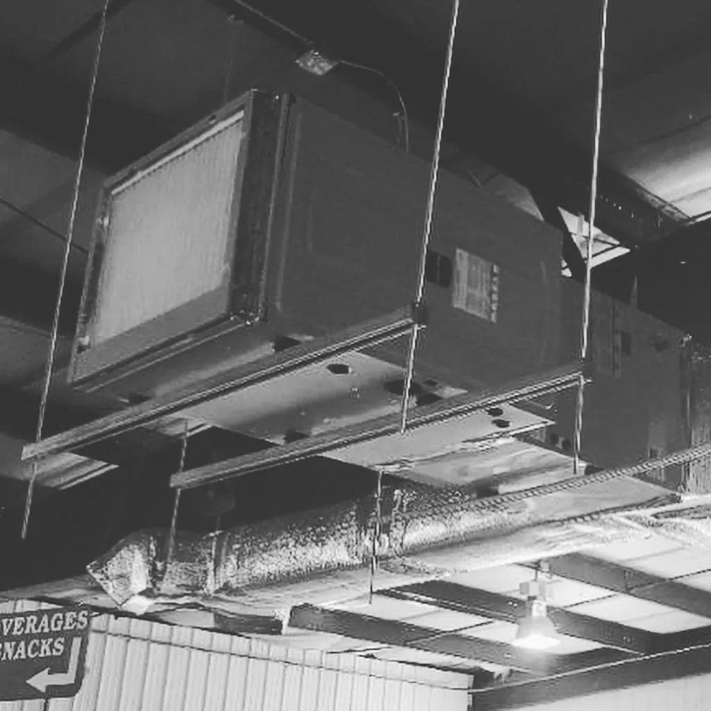 Air conditioning unit hanging from ceiling.