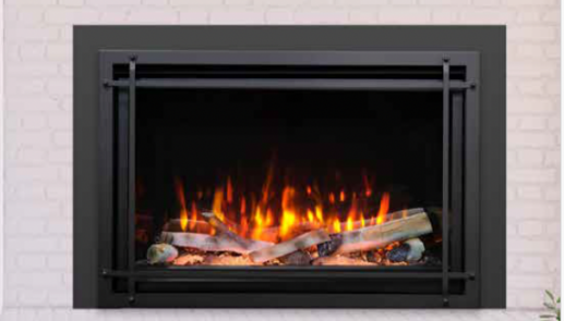 A fireplace with a black frame and a white brick wall.