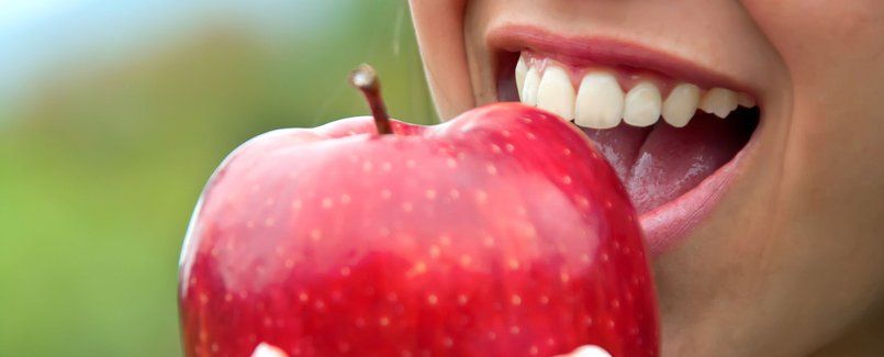 Woman eating apple