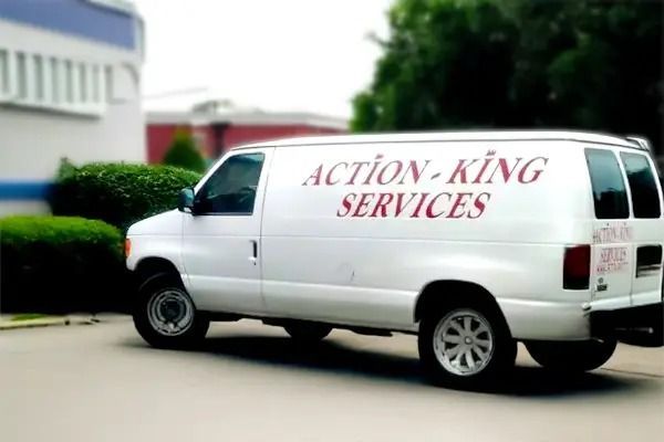 Group of people posing in front of a septic service truck.