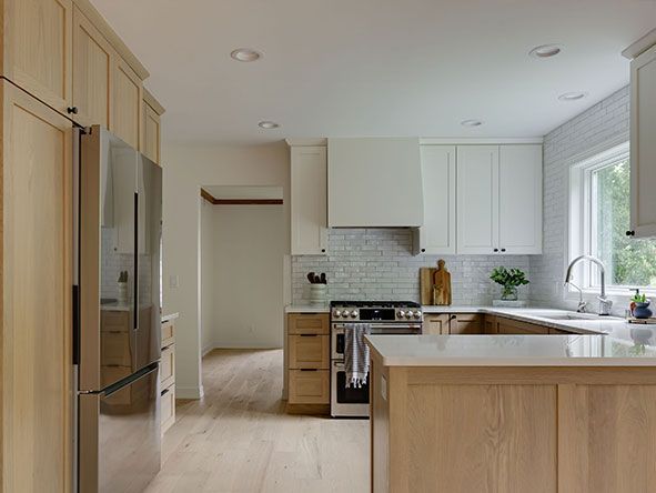Modern kitchen with light wood and white cabinetry