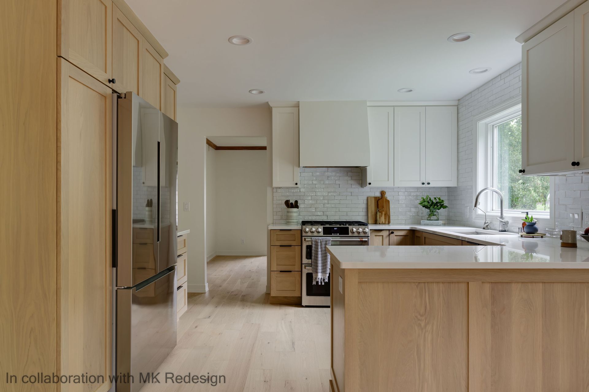 A kitchen with wooden cabinets and stainless steel appliances