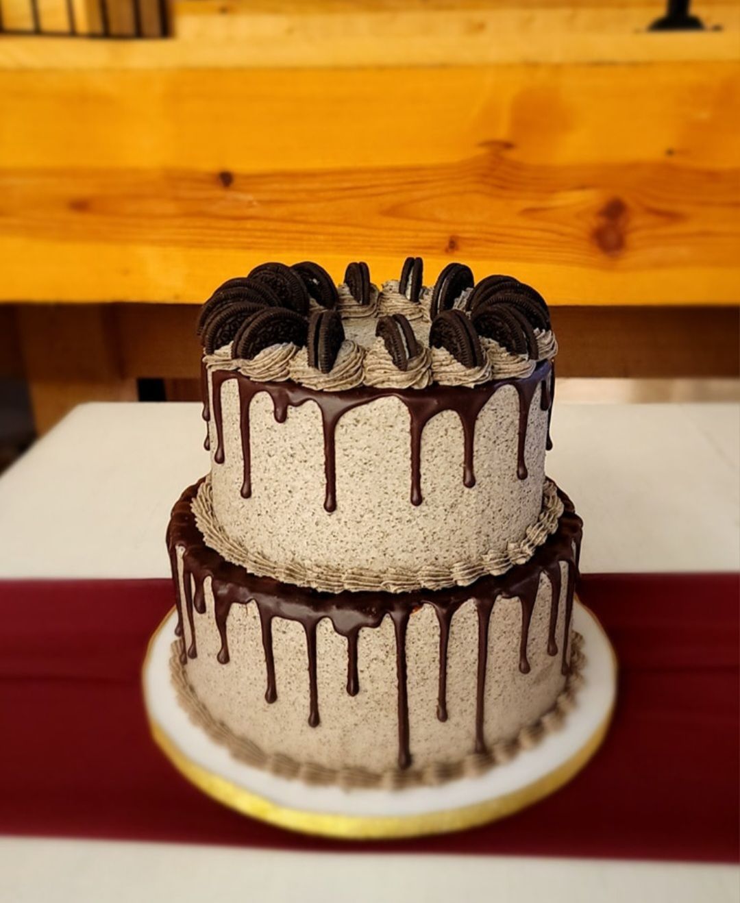 A cake with oreos on top is sitting on a table