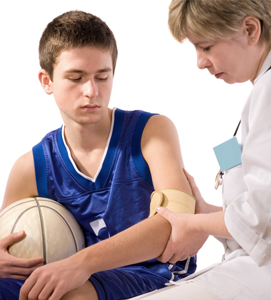teenager athlete injured and being checked by a doctor