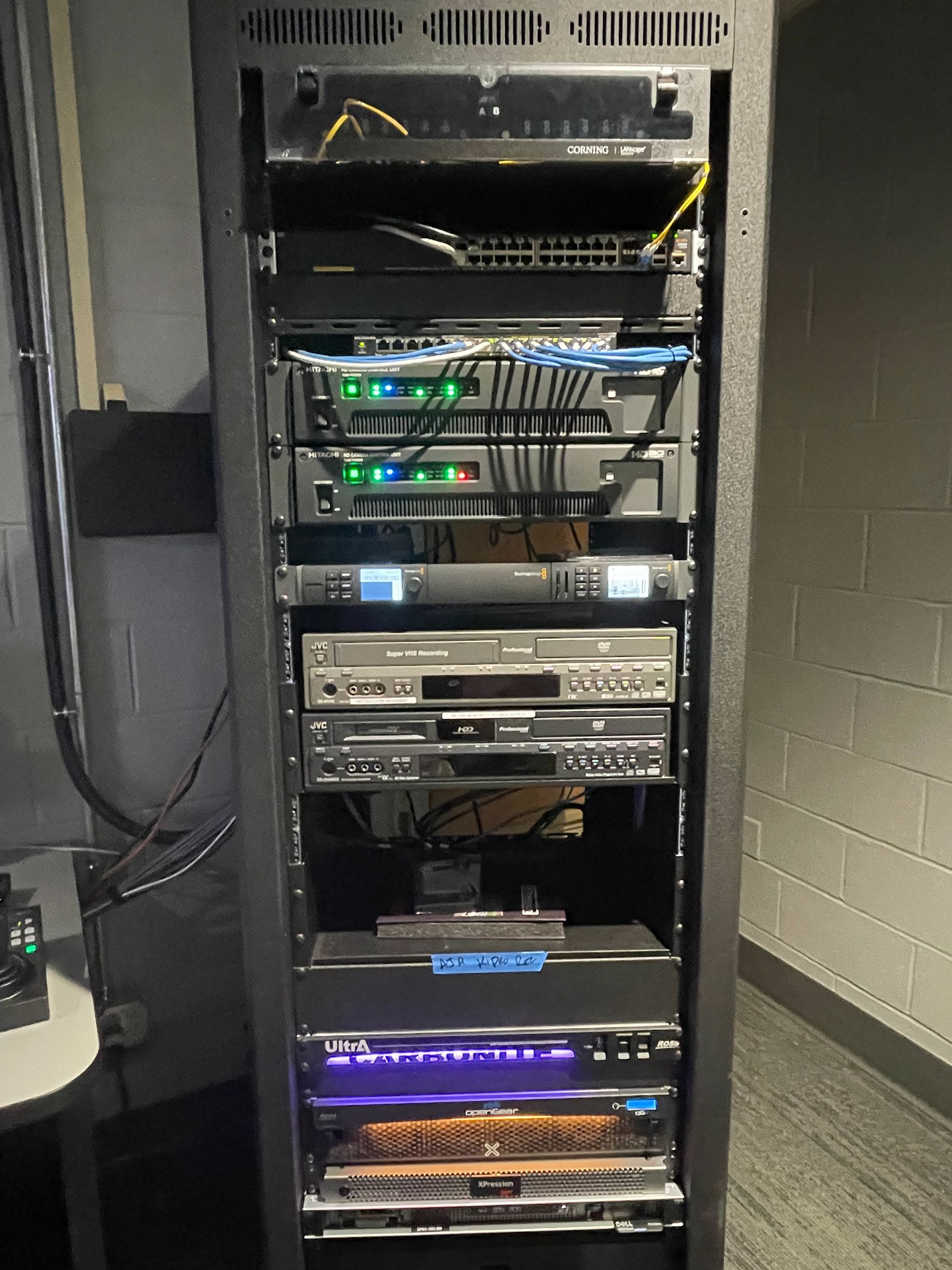 A server rack with a lot of electronics on it