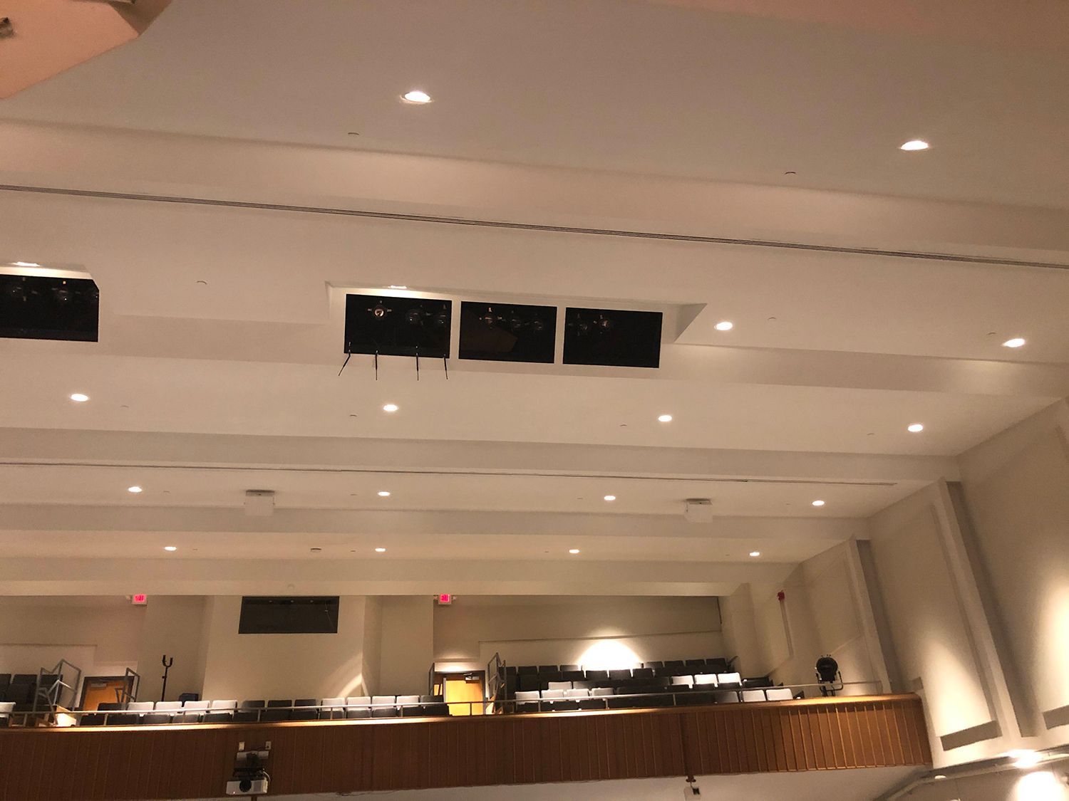 A large room with a lot of lights on the ceiling