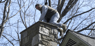A man repairing chimney