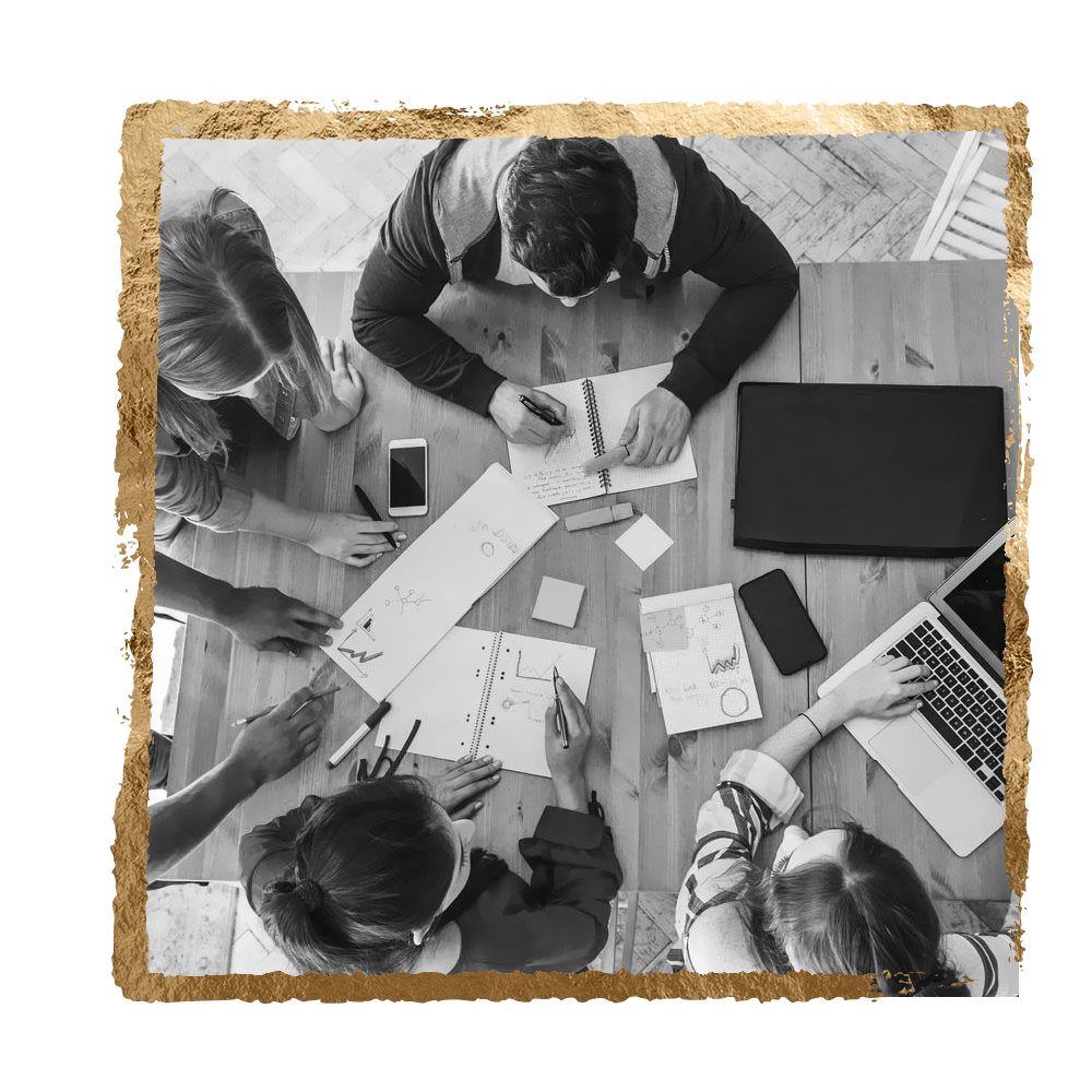 Team of people collaborating around a table