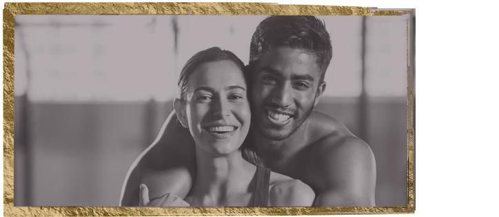 a man and a woman are hugging each other and smiling