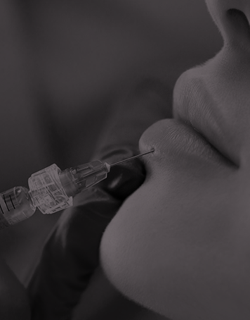 A woman is getting a facial treatment at a beauty salon.