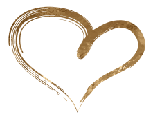 A gold heart is drawn with a brush on a white background.
