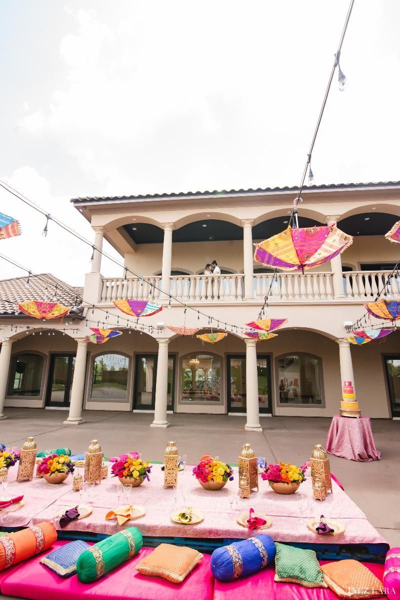 A large building with a table set up in front of it.