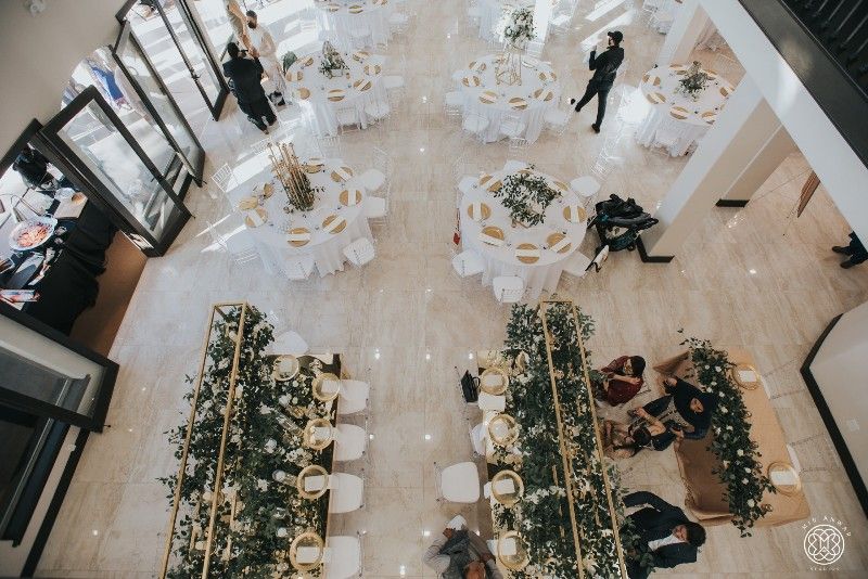 An aerial view of a large room filled with tables and chairs.