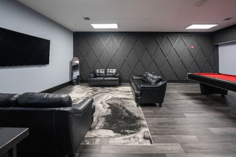 There is a pool table in the middle of the room.