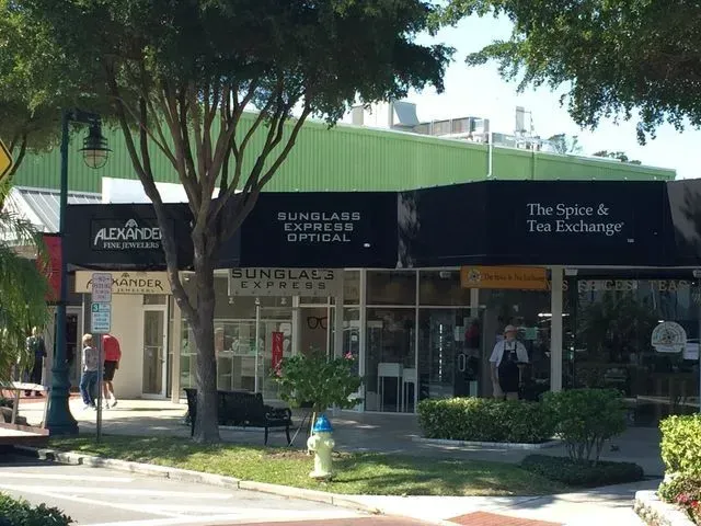 a store front with a black awning that says the space & tea exchange