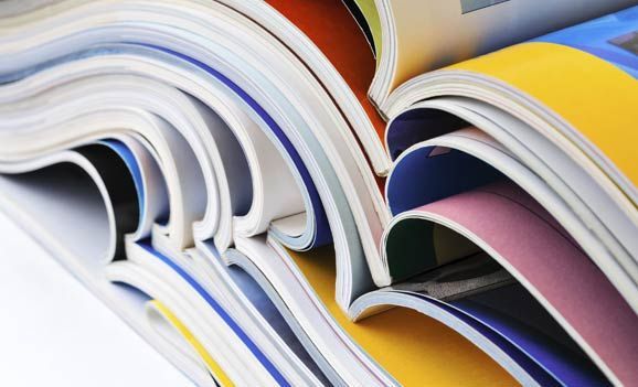 A close up of a stack of colorful books