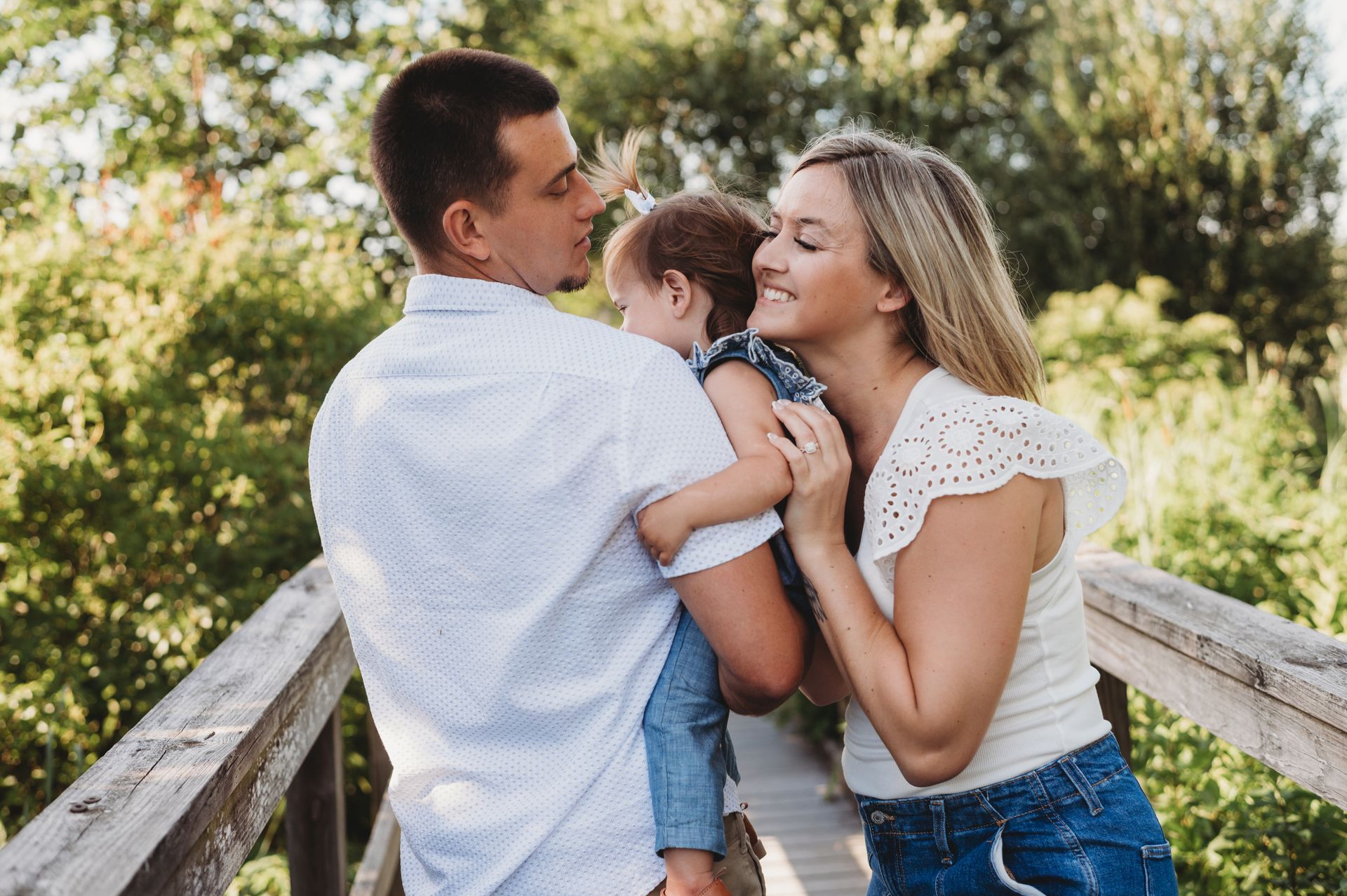 Woman in burgundy sports bra and leggings, two blurred women on either side.