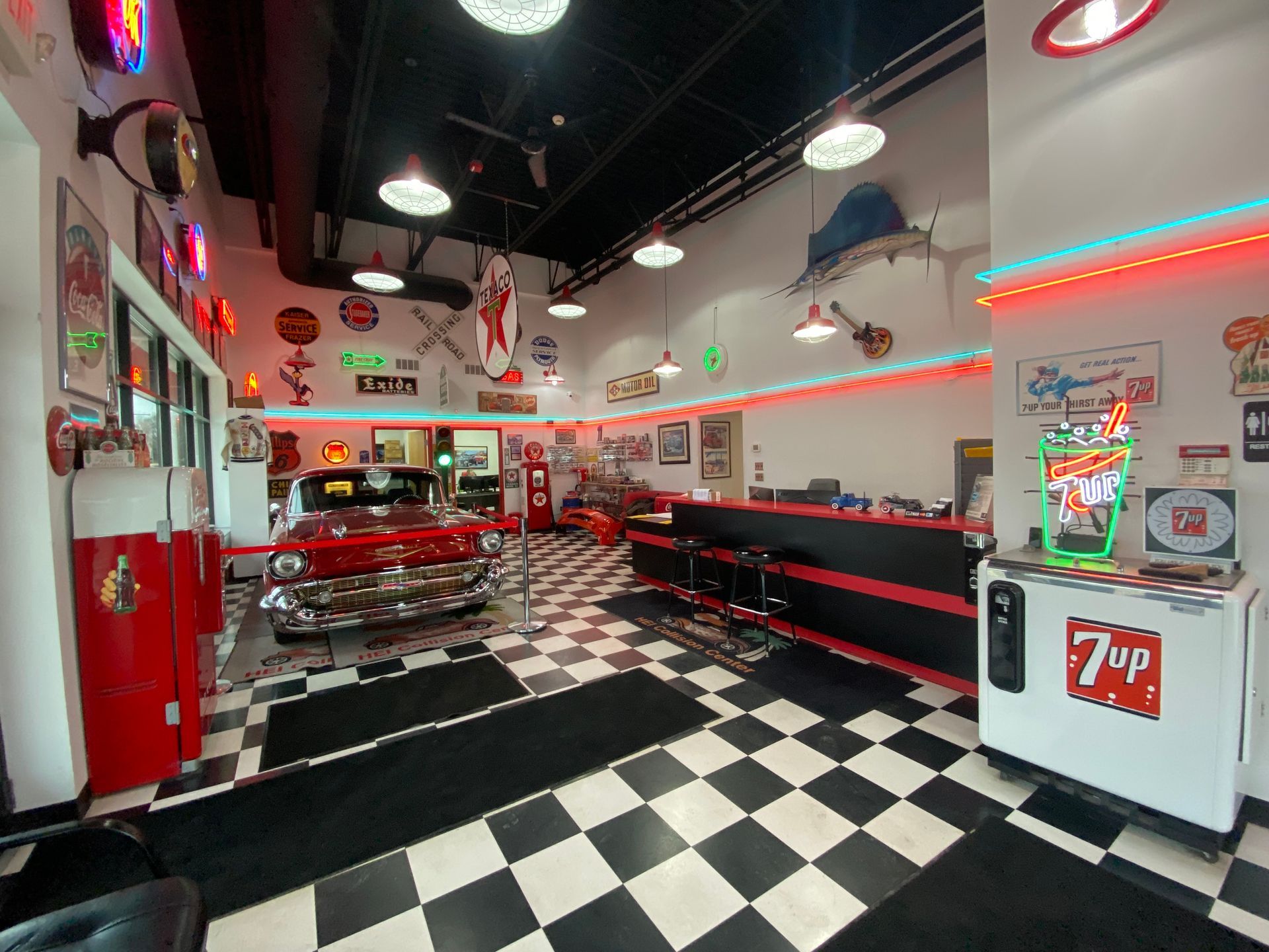 A diner with a checkered floor and a 7up machine