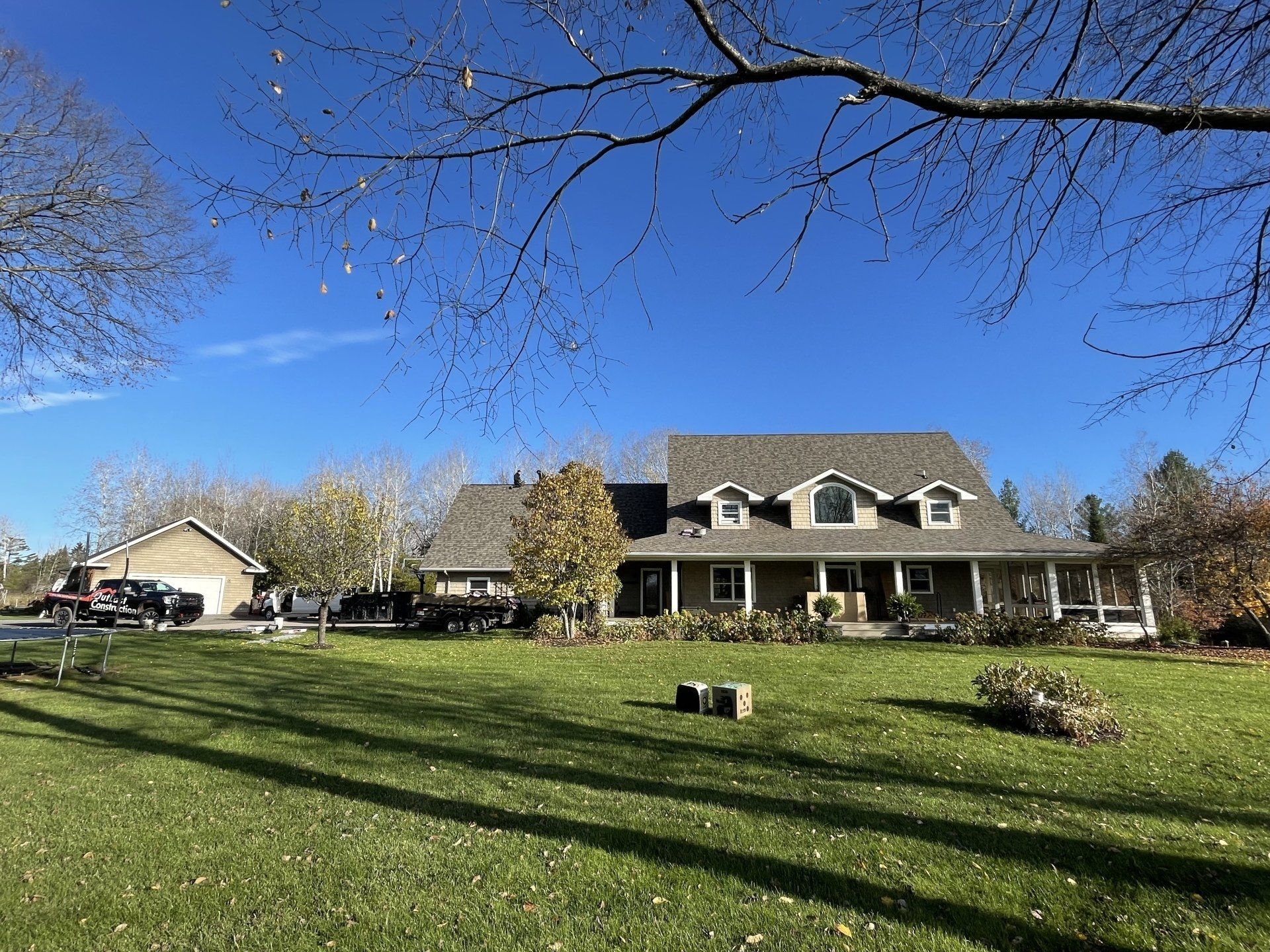 A large house with a large lawn in front of it.