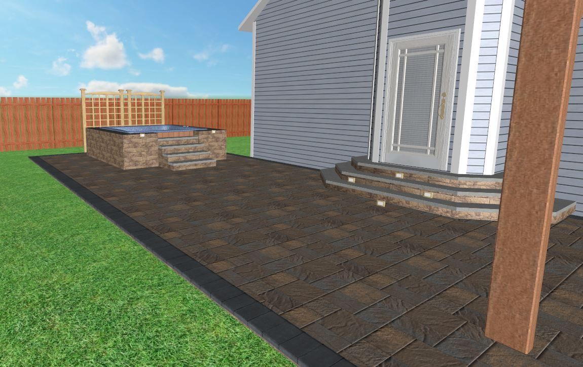 Backyard patio with hot tub and stairs leading to a house door; brown pavers on patio.