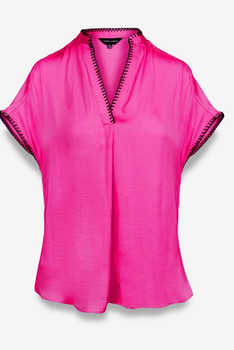 Bright pink blouse with black trim on collar and sleeves.