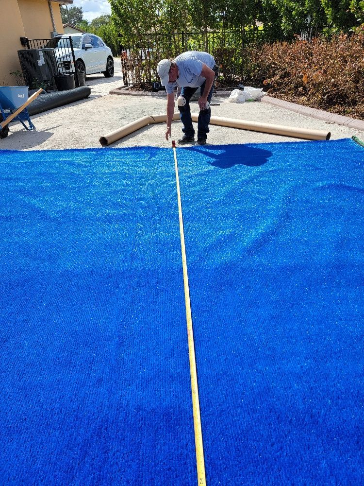 Man measuring the turf