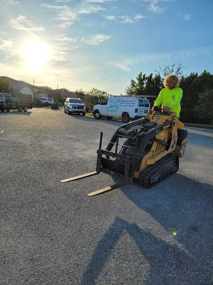 A man driving a forklift