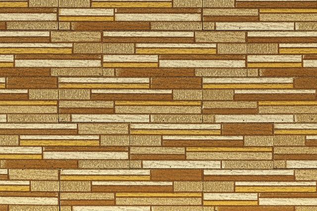 Textured wall with horizontal rectangular bricks in various shades of brown and beige.