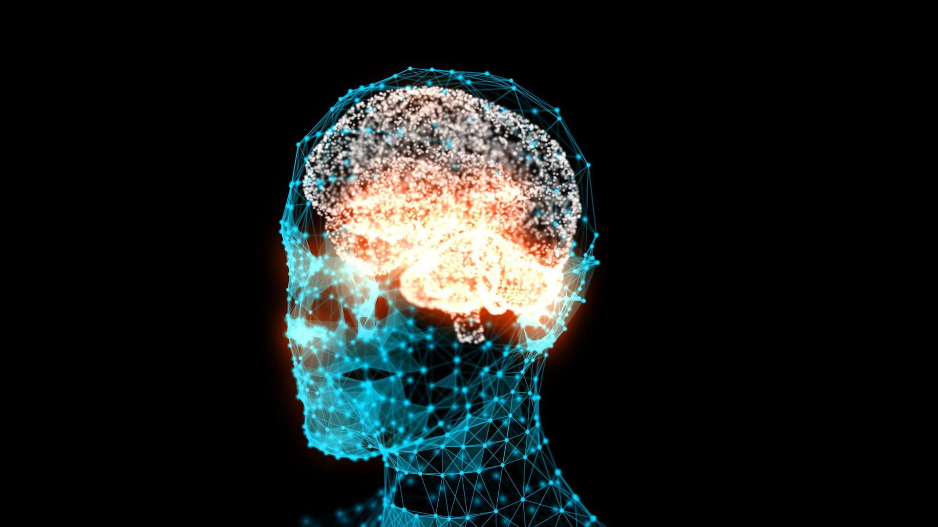 A woman in a black scrub top is smiling for the camera.