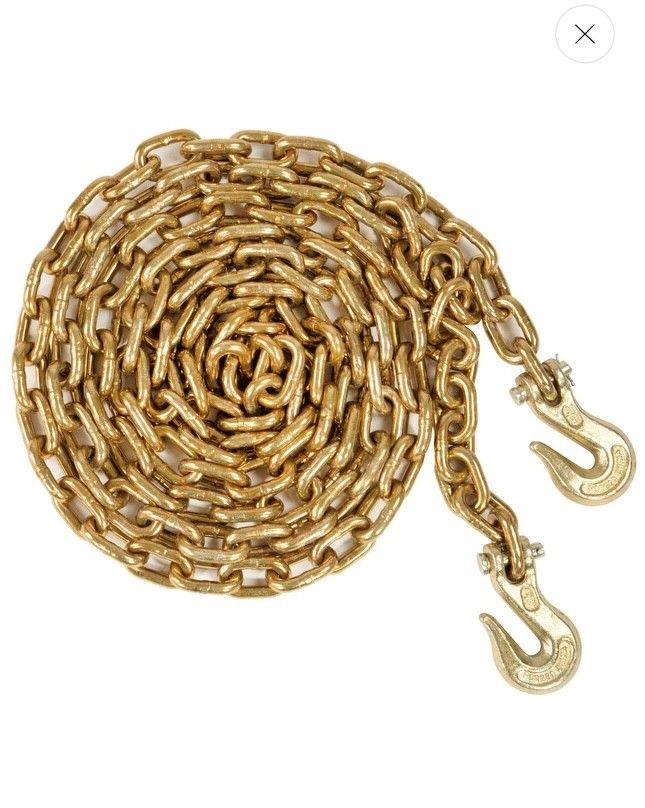 Coiled gold-tone chain with two lobster clasps on a white background