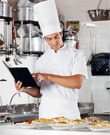 chef going over cooking checklist