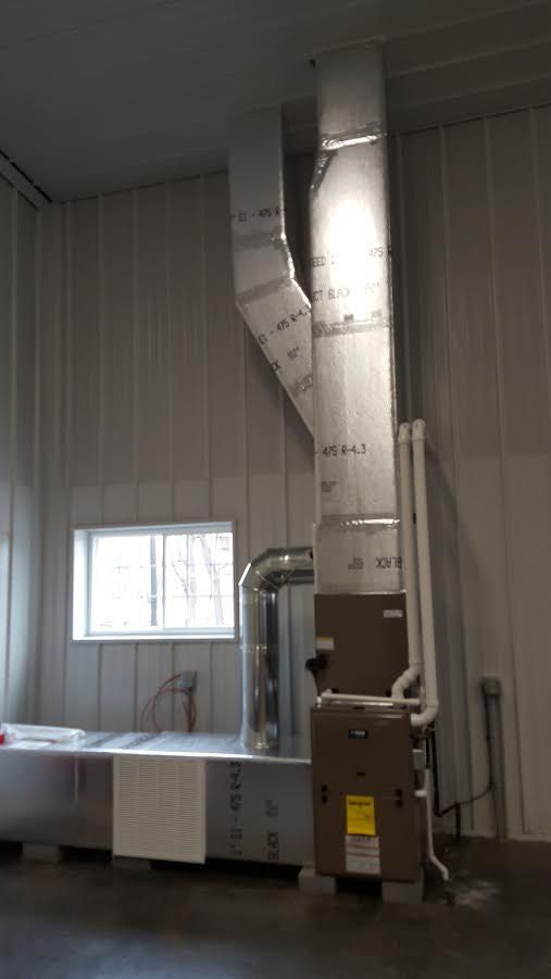 a room with a heater and a window in it .