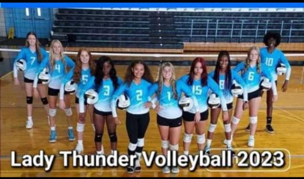 Lady Thunder Volleyball team poses for a photo in light blue uniforms, 2023.
