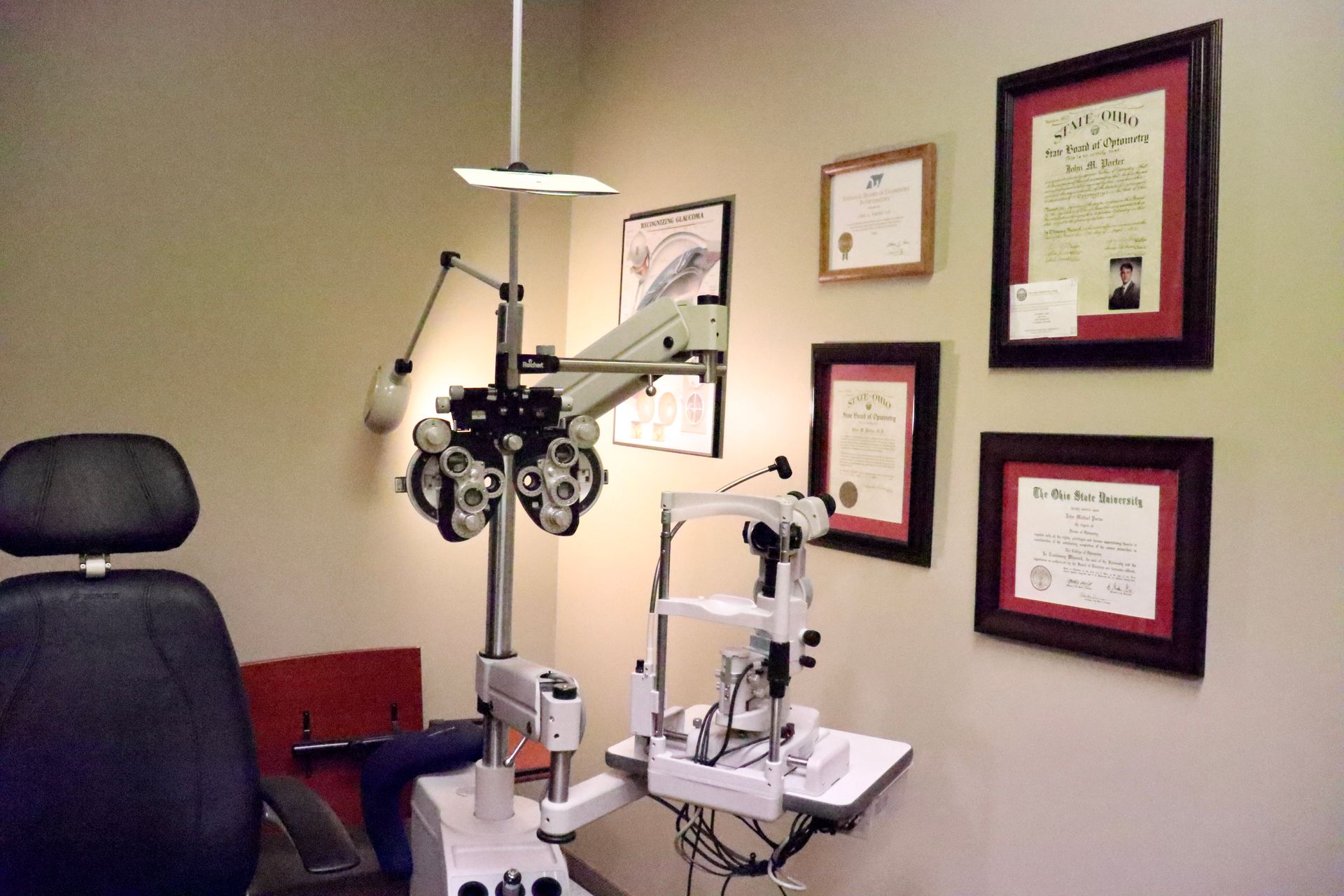 An ophthalmologist 's office with several framed pictures on the wall