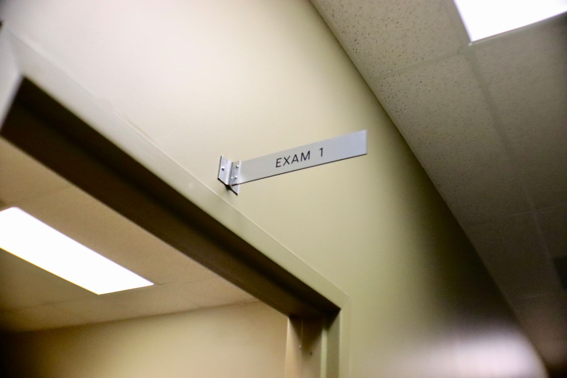 A doorway with a sign that says exam 1 on it