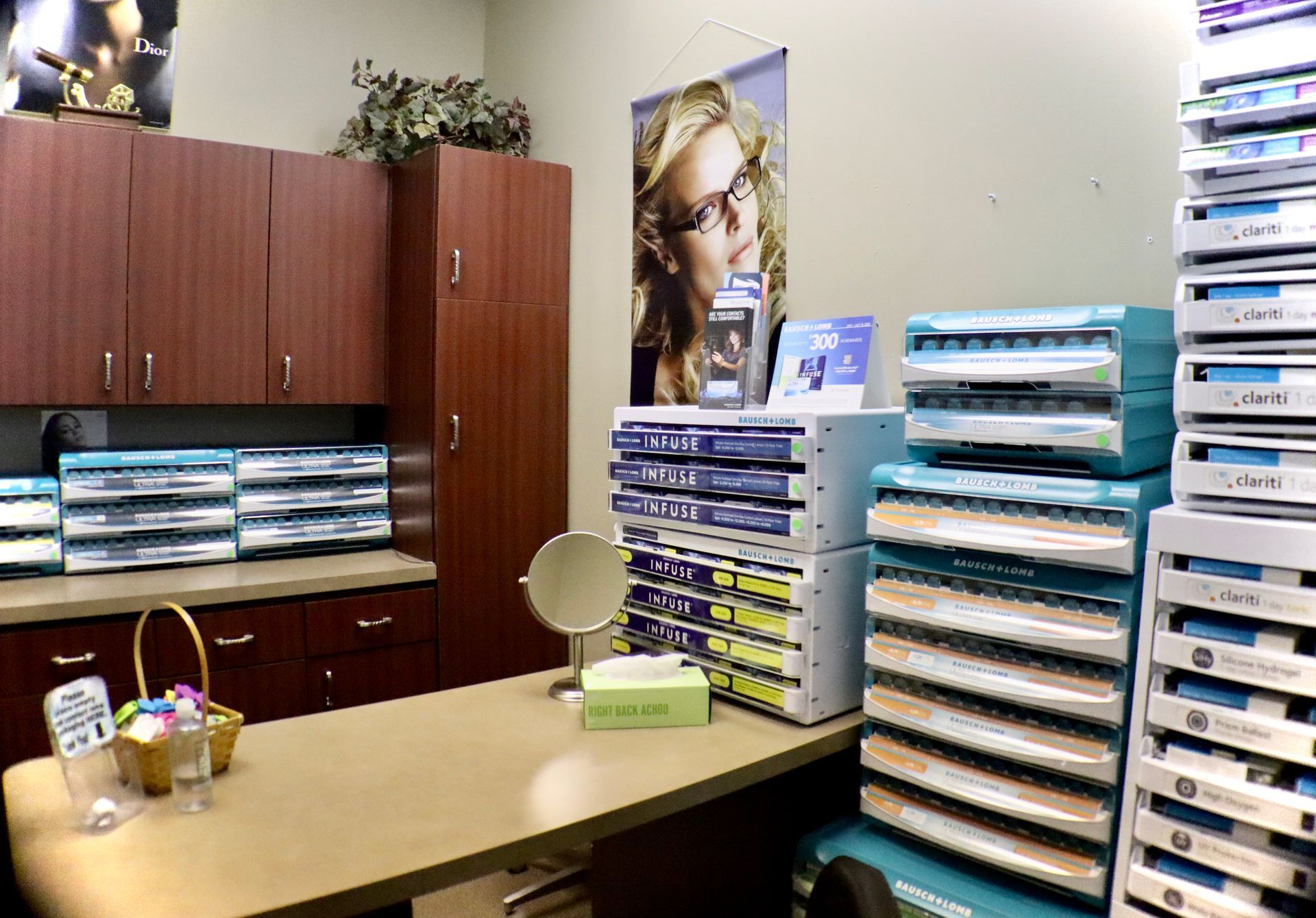 A room filled with lots of boxes of contact lenses and a mirror.