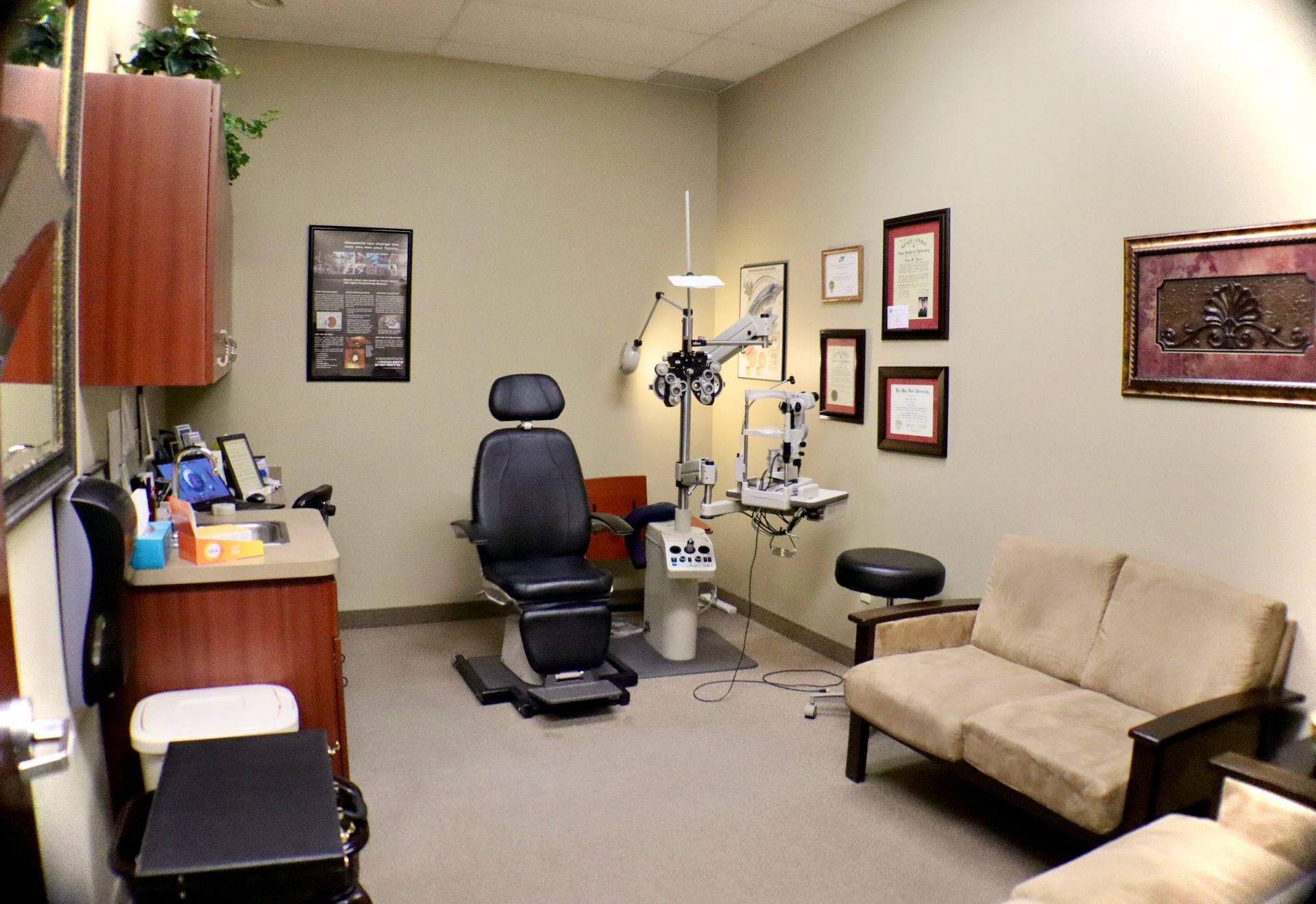 A dental office with a chair and a couch