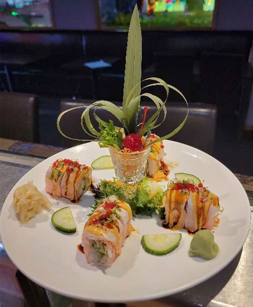 Tasty sushi with cocktail 