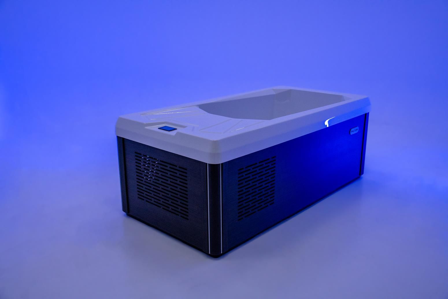 Blue and black cooling machine, with a white basin on top.