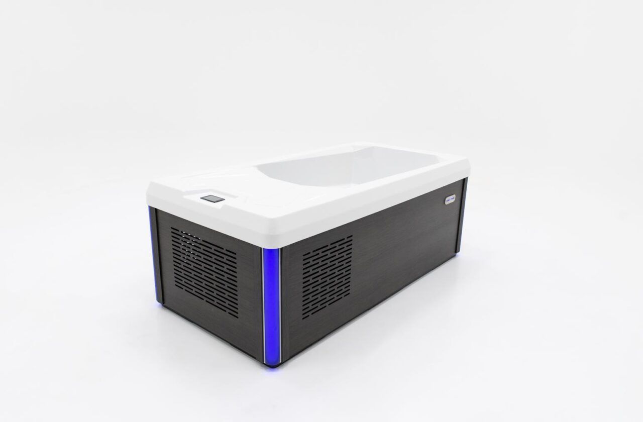 Black and white rectangular device with blue accents, possibly a laser cutter, on a white surface.