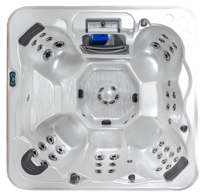 Top-down view of a light gray hot tub with multiple seating areas, jets, and central control panel.