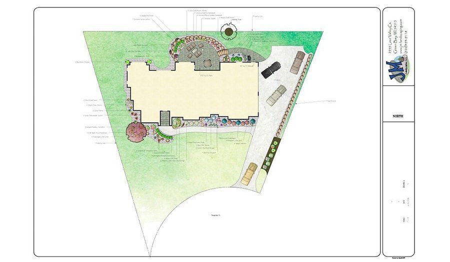 Overhead view of a building's landscape plan with colored lawn, pathways, parking, and a small garden.