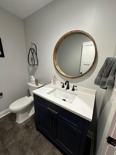 modern bathroom with circular mirror