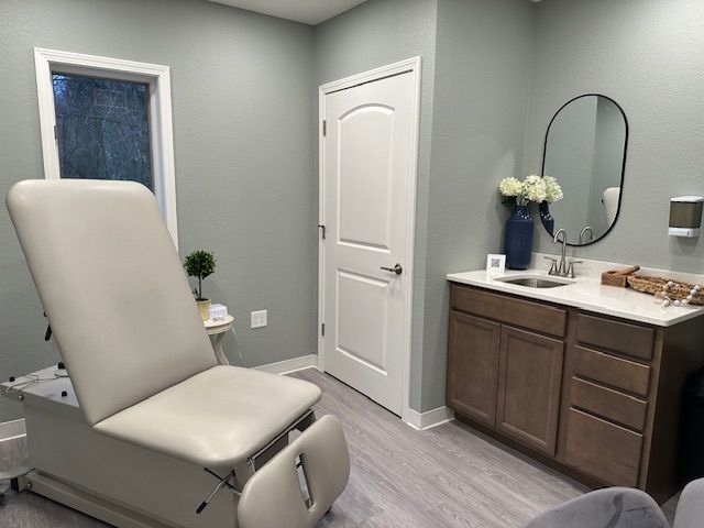 examination room with a power exam table