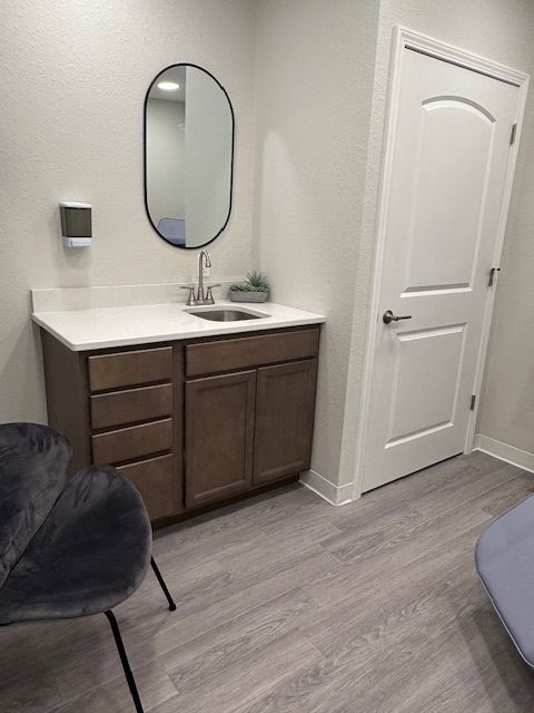 room with sink and cabinets