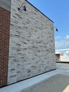 A brick building with a white brick wall.