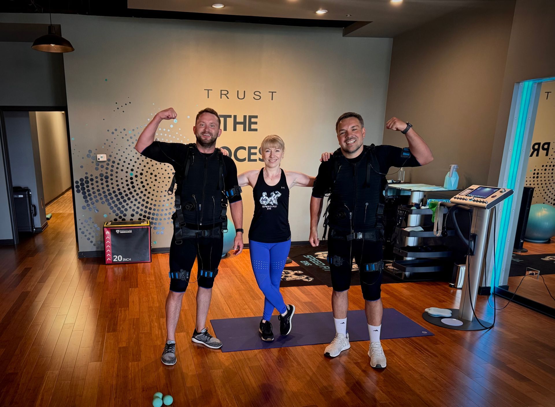 Clients completing a customized EMS personal training session at SpeedFit EMS Schaumburg