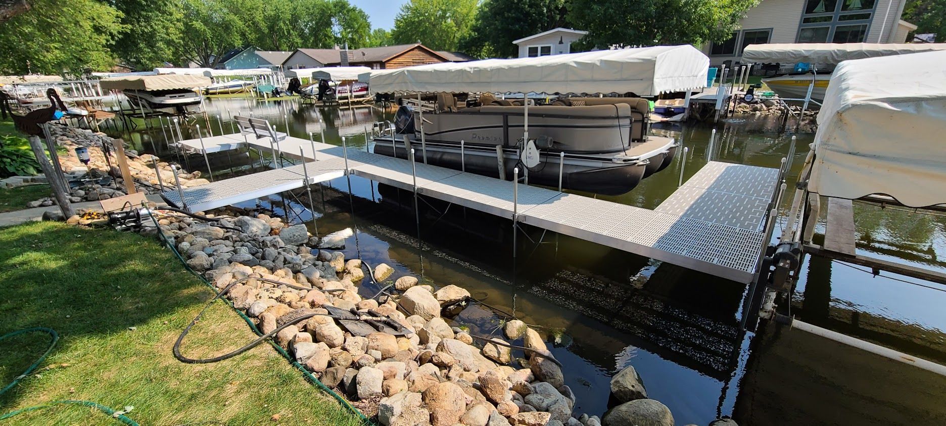 A large body of water with a dock in the middle of it.