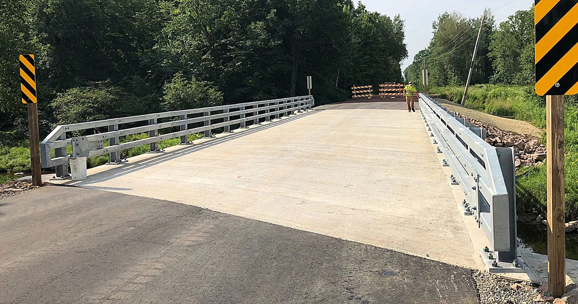 A bridge is being built on a dirt road.
