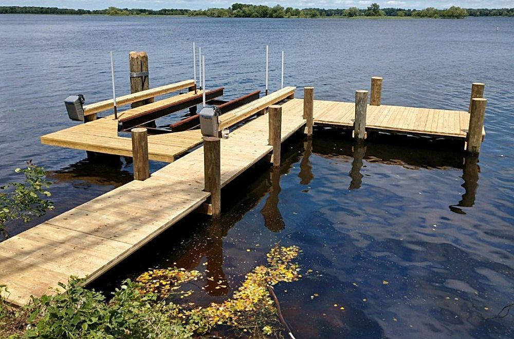 A wooden dock in the middle of a lake